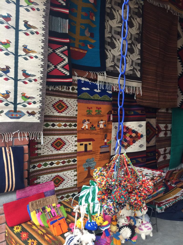 Market stand with woven textiles in various, local designs 