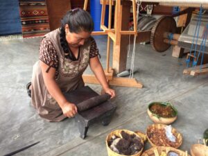 Process of grinding cochineal down to a powder.